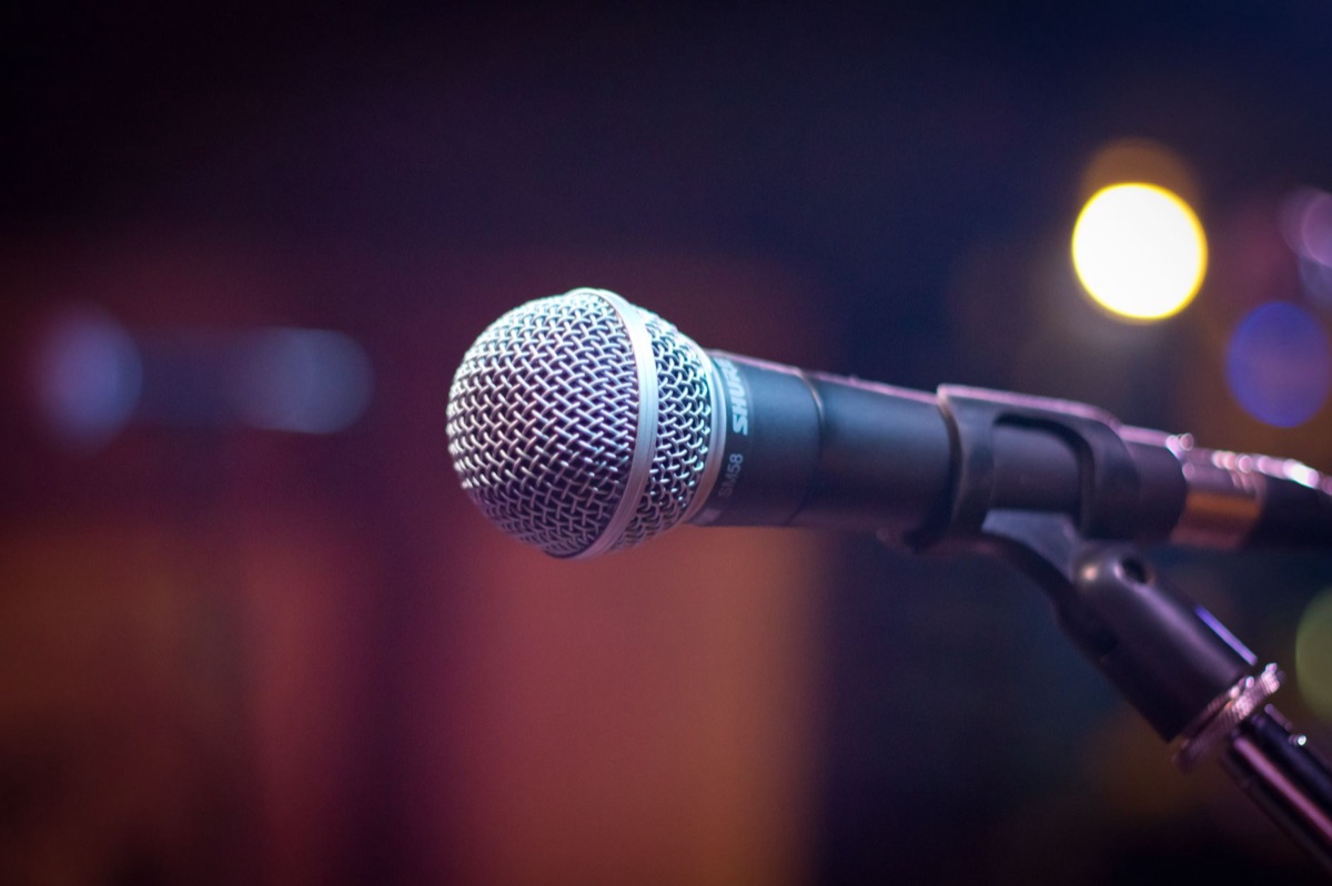 Kpop artist with microphone in studio