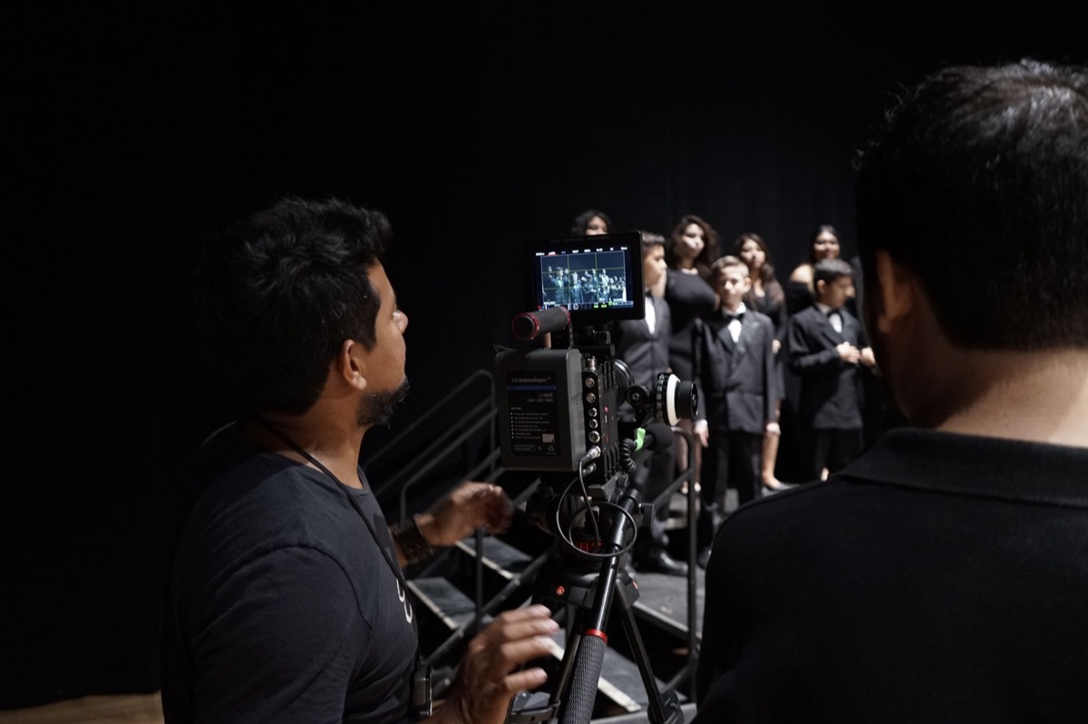 Music video director standing in front of a green screen