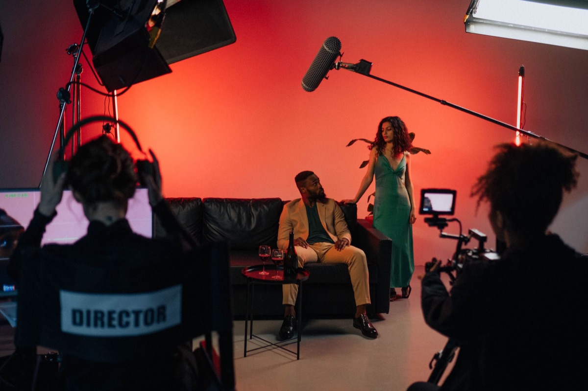 Director standing in front of green screen for K-pop music video