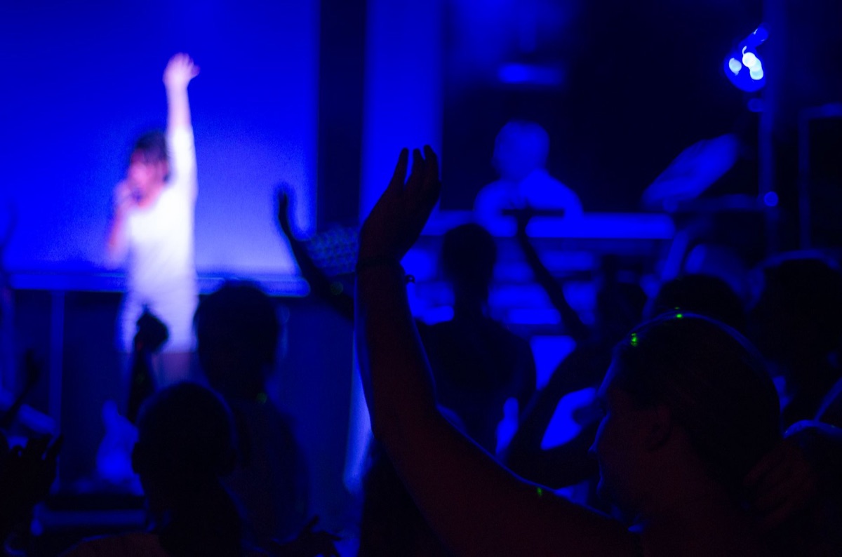 K-pop idol at stage center during debut song performance