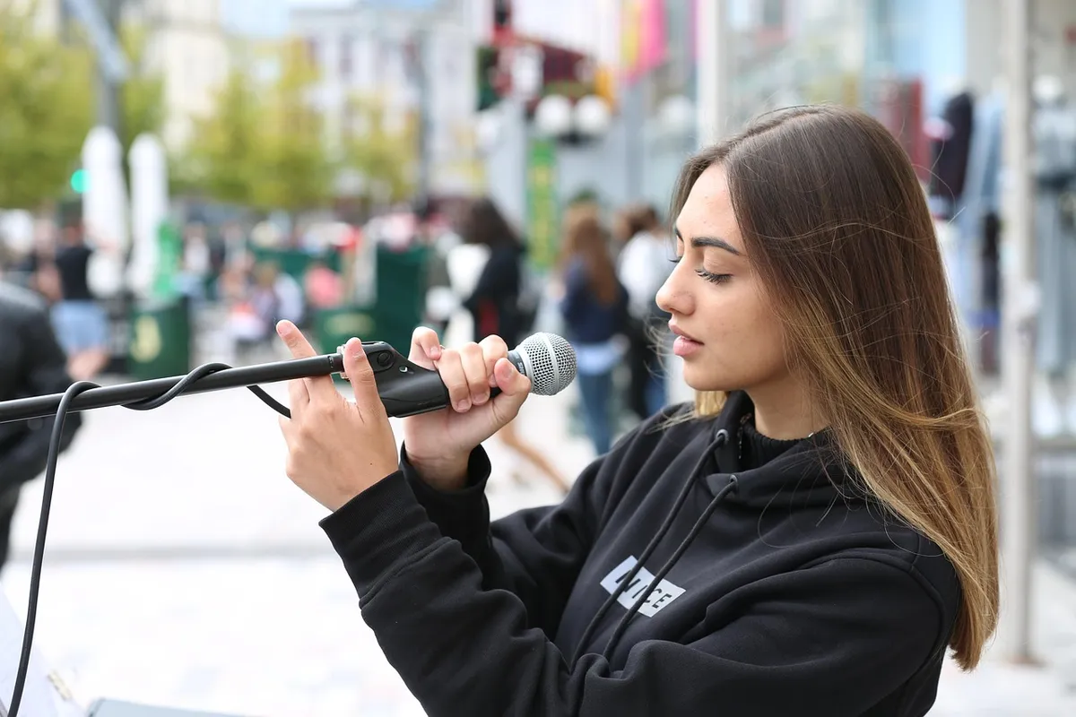 singer, music, street performance, song, microphone, street performer, artist, woman, girl, outdoors, urban, microphone, microphone, microphone, microphone, mic